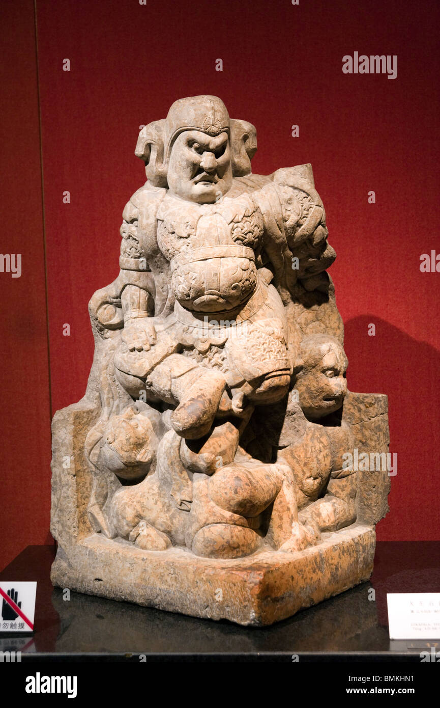 Chinese Buddhist stone sculpture of Lokapala, Tang Dynasty A.D. 618-907 in the Shanghai Museum, Shanghai, China Stock Photo
