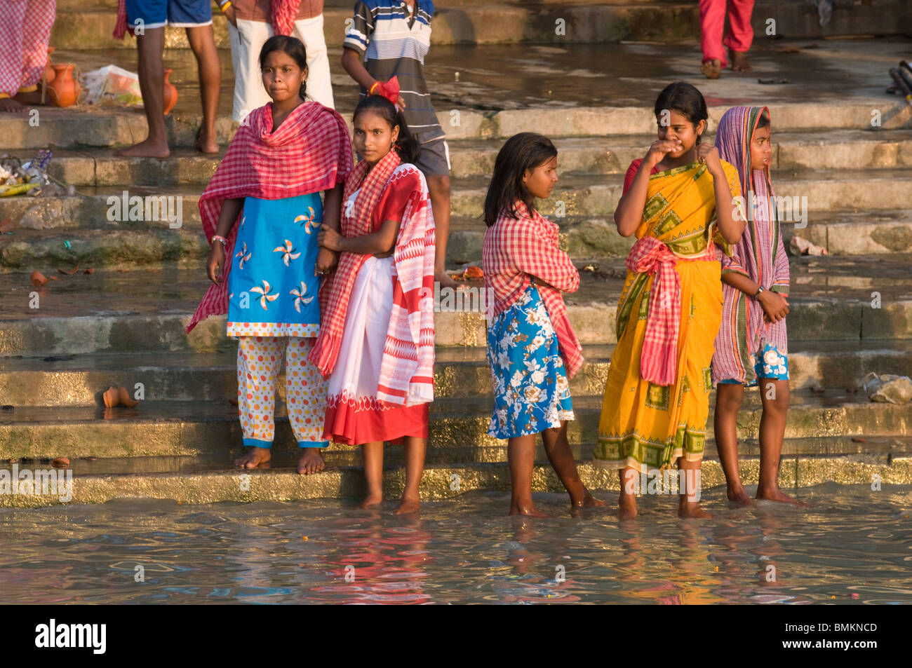 People bathing in shallow water of the Hoogly river. Calcutta. India. Stock Photo