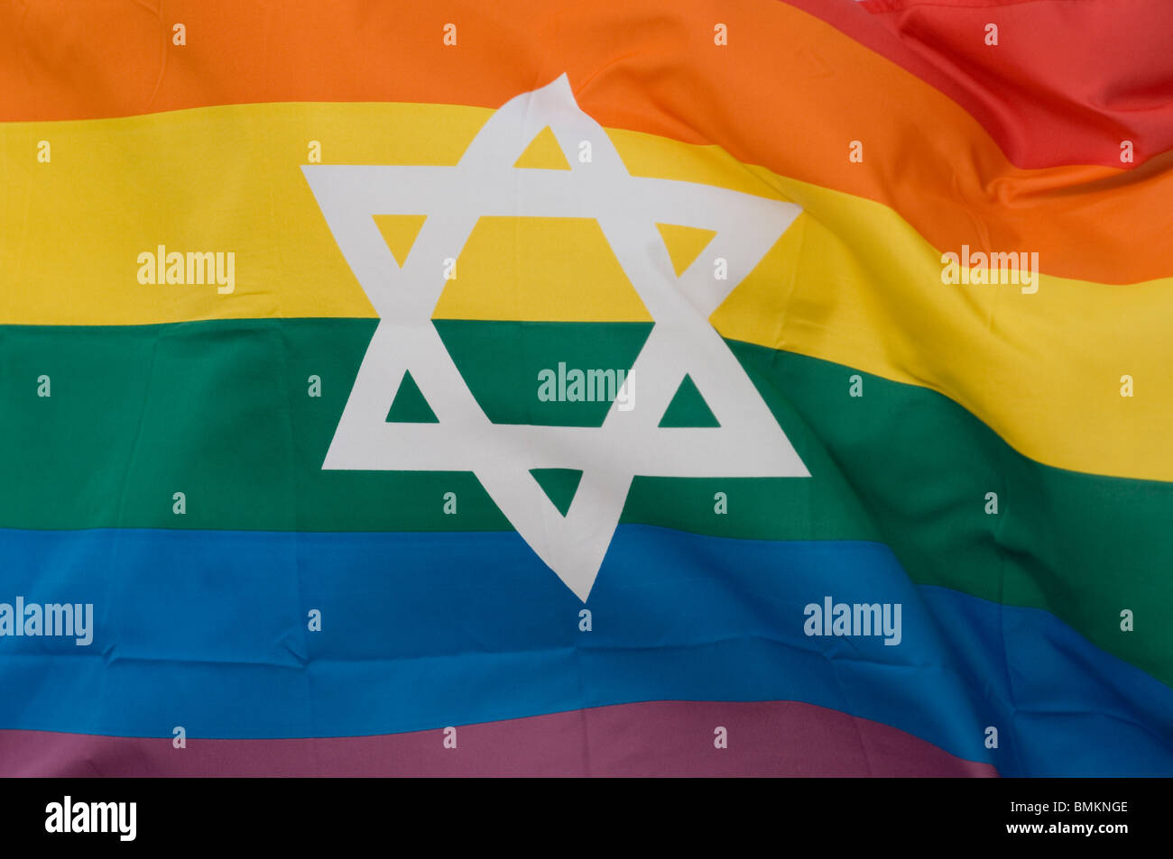 The rainbow flag symbol of LGBTQ Pride bearing the Jewish Star of David. Israel Stock Photo