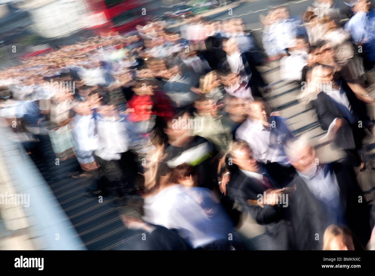 Commuters on London Bridge during rush hour Stock Photo