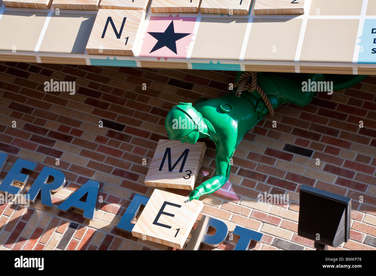 Green army men use Tinker Toys to lift a Scrabble board into place at Disney's Hollywood Studios Stock Photo