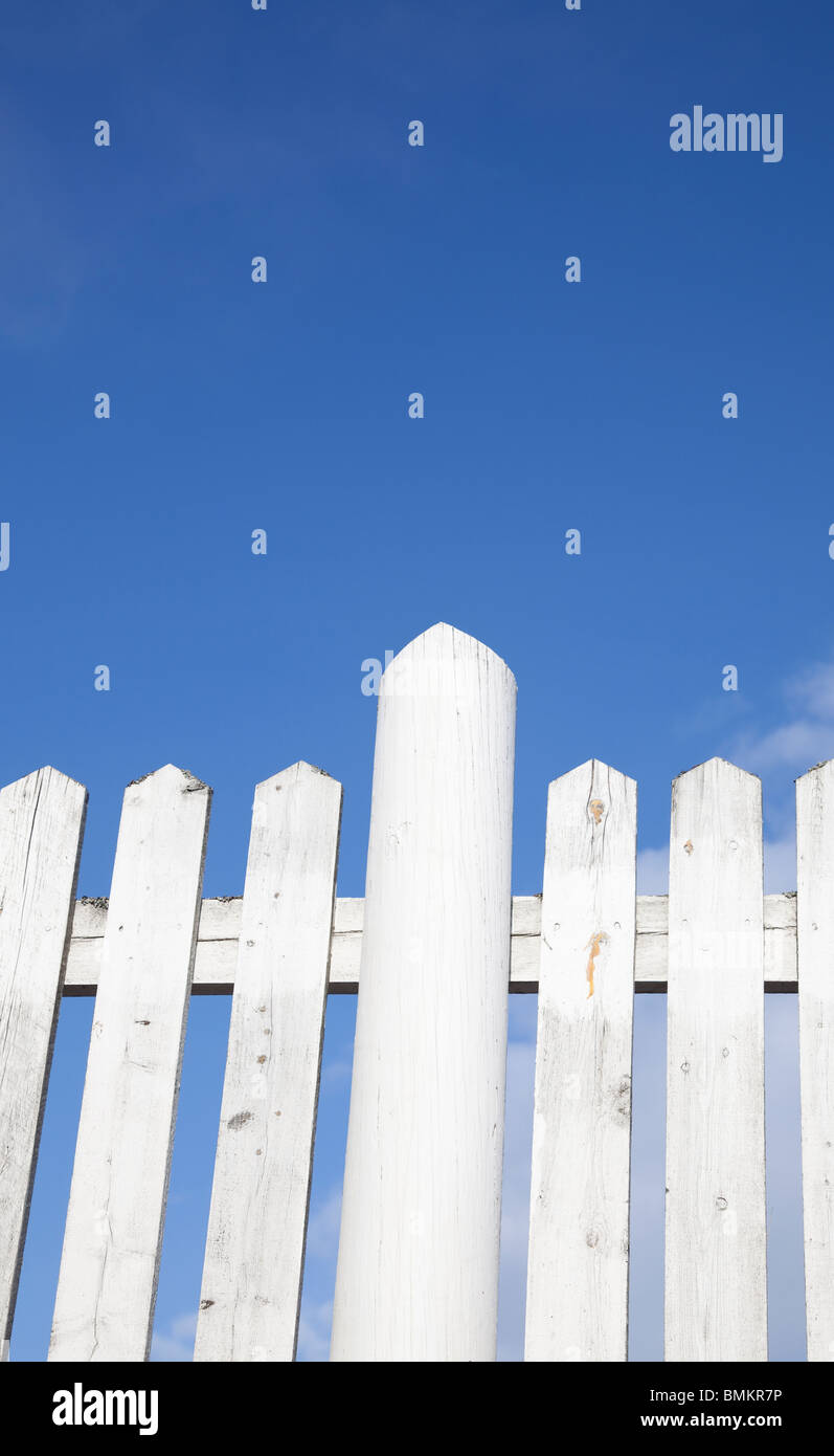 White picket fence against blue sky Stock Photo - Alamy