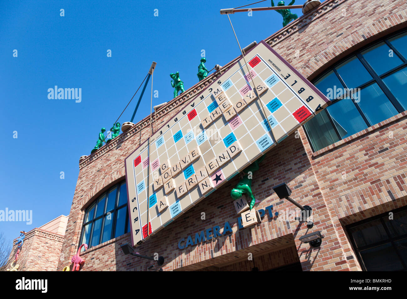 Green army men use Tinker Toys to lift a Scrabble board into place at Disney's Hollywood Studios Stock Photo