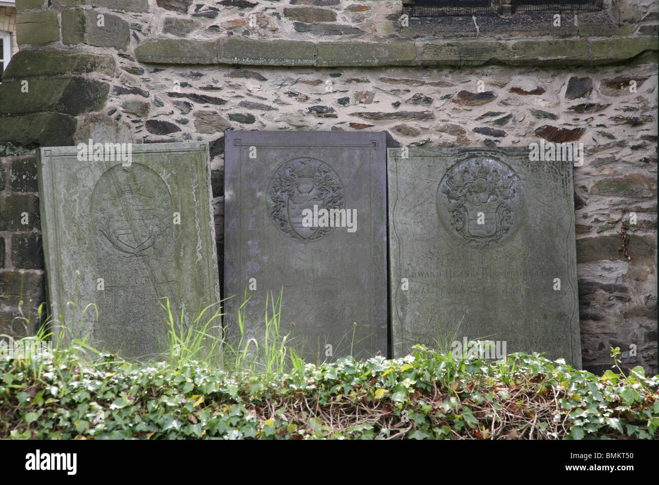 gravestones in a church cemetery Stock Photo