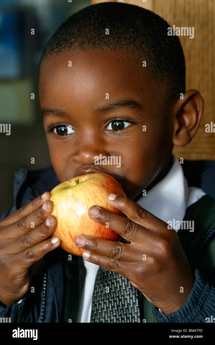 5-7 year old olds Child eating apple .MR  © Myrleen Pearson Stock Photo