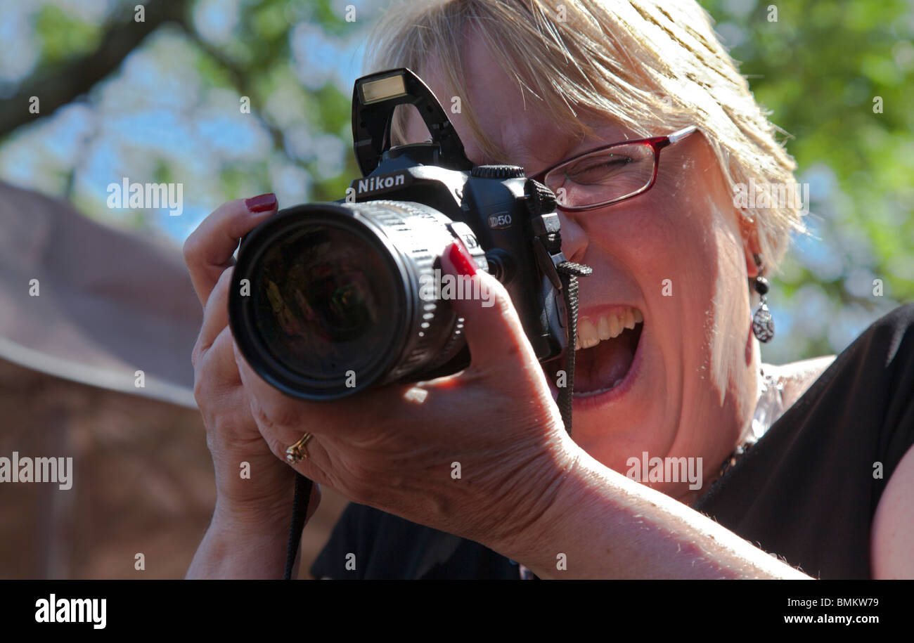 Detroit, Michigan - An amateur photographer takes a picture with her Nikon. Stock Photo
