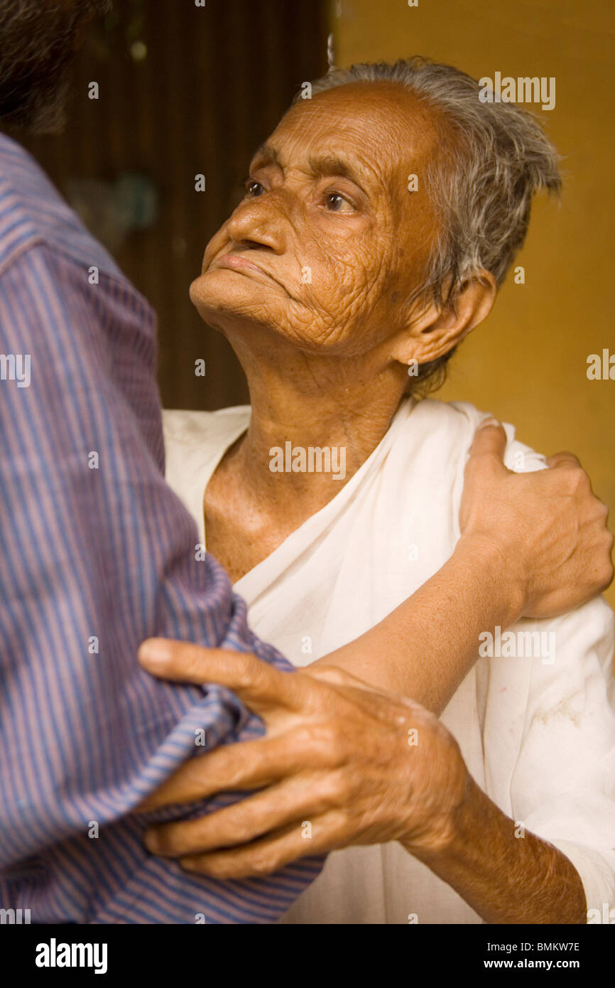 100 years old Bengali widow meeting her blood relative from India after decades; village Tauta; District Manikgunj; Bangladesh Stock Photo