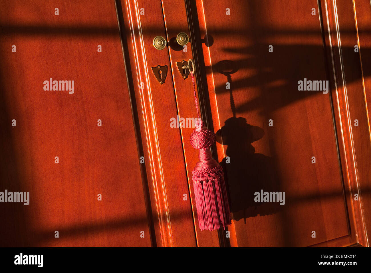Detail of key inside keyhole of closet Stock Photo