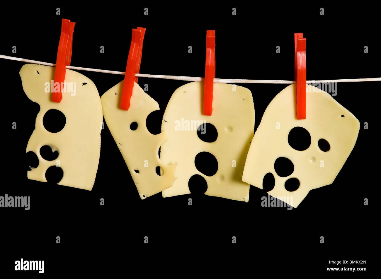 Cheese slices on the washing line Stock Photo - Alamy
