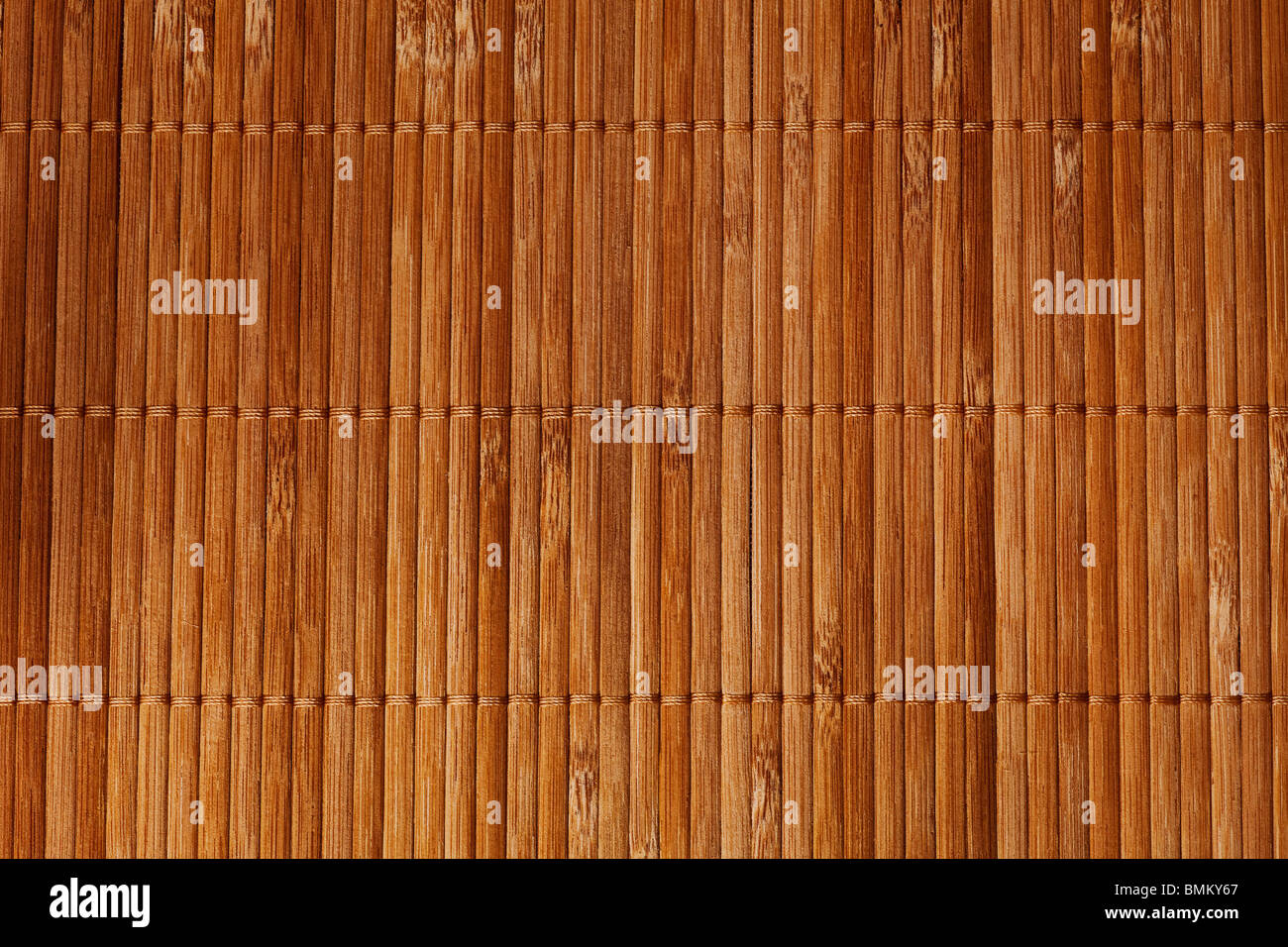 natural bamboo slatted mat background in brown tones Stock Photo
