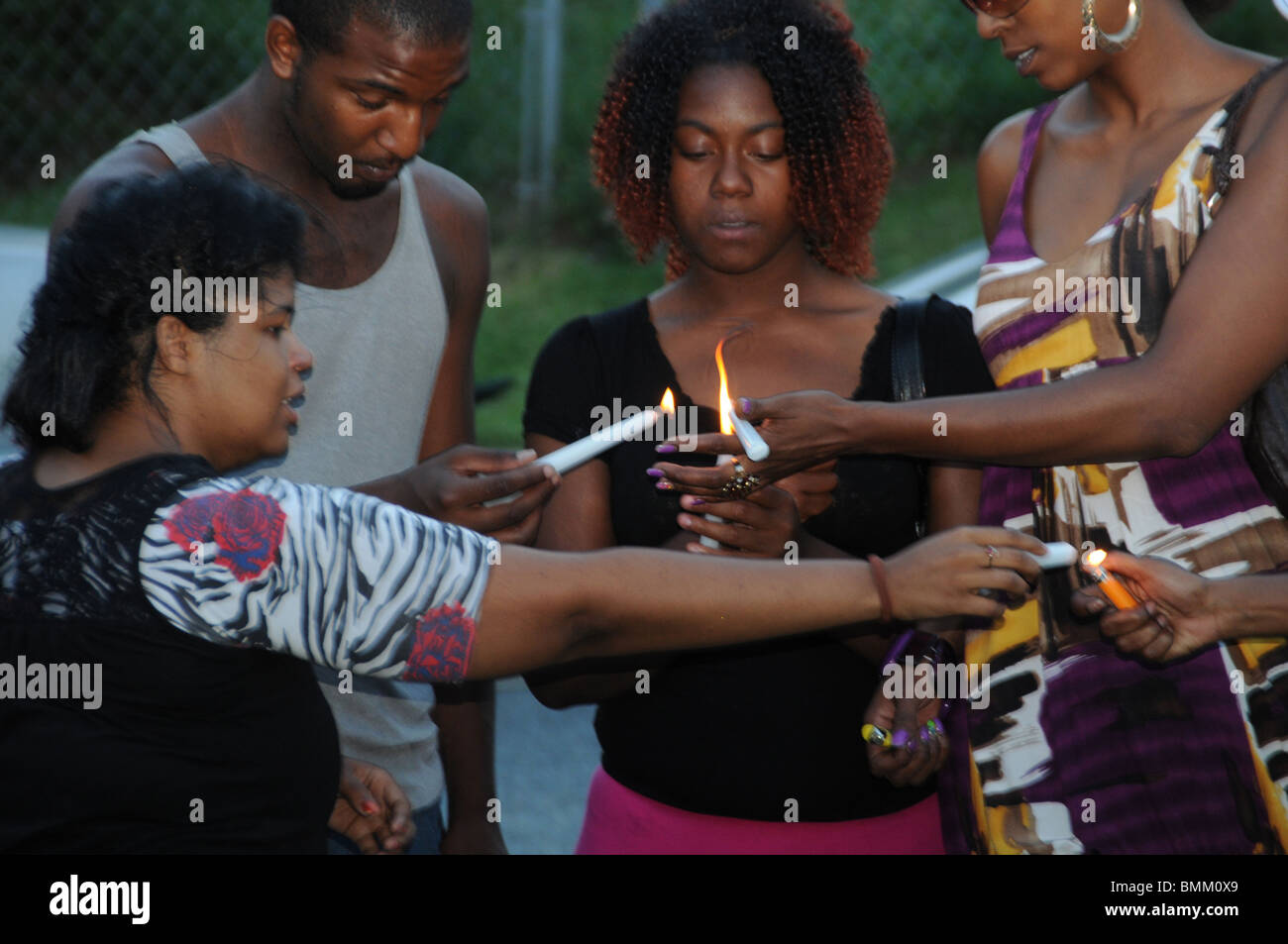 residents light candles outside the home of Md State Trooper Wesley Brown home in Seat Pleasant after he gunned down nearby Stock Photo