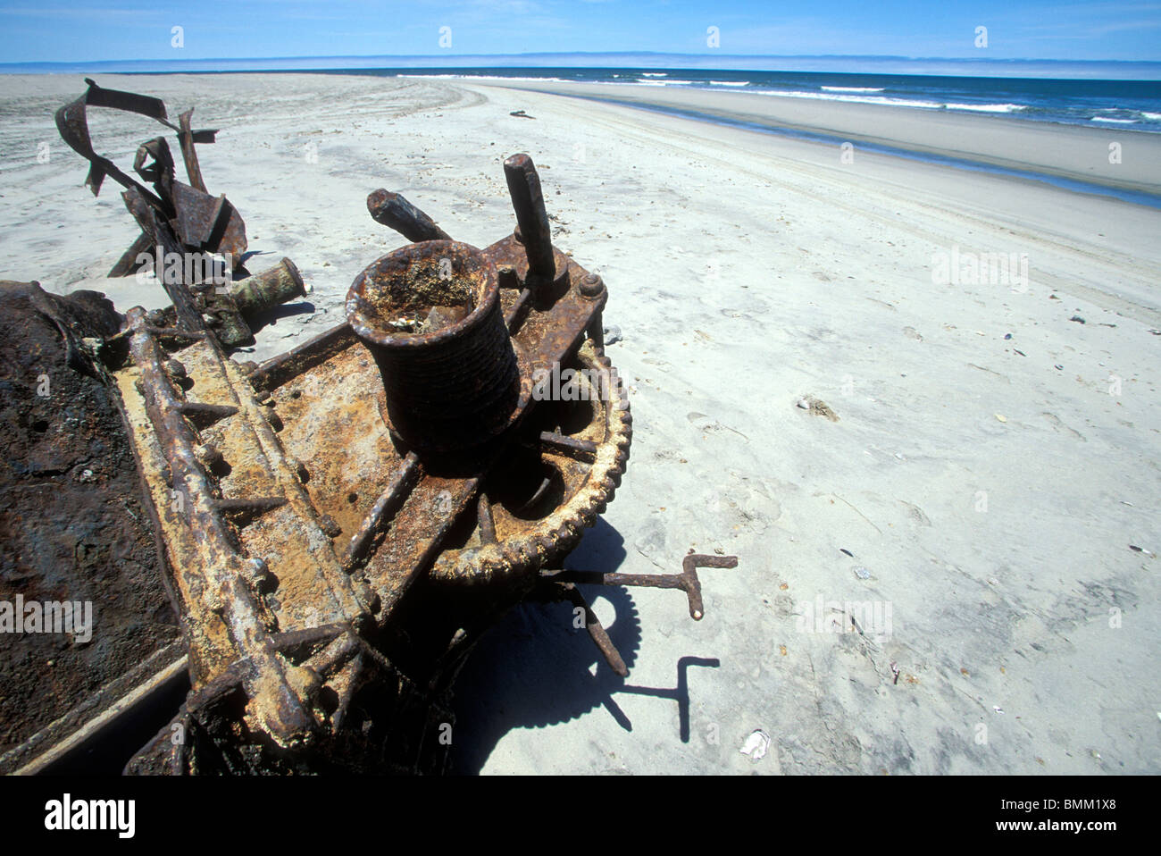 Namibia, Skeleton Coast, Rusted remains of shipwreck buried in beach Stock Photo