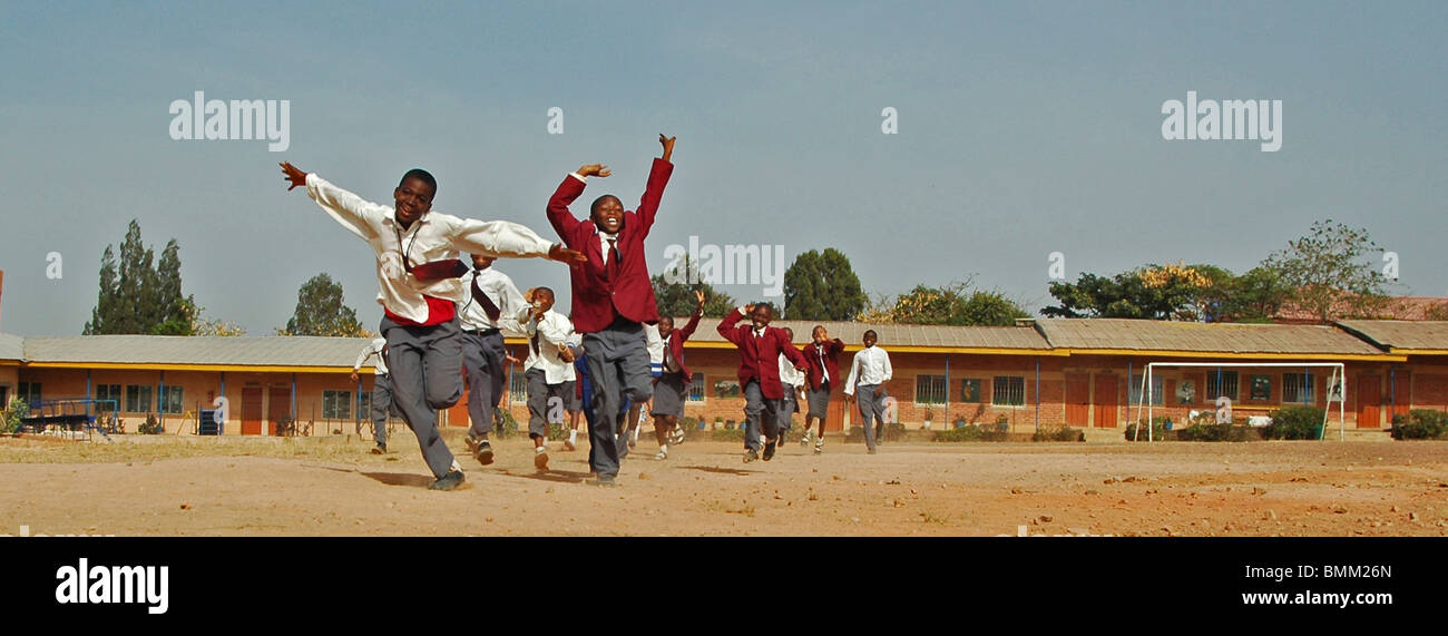 Nigeria, Jos, Schoolboys and schoolgirls in their purple and blue