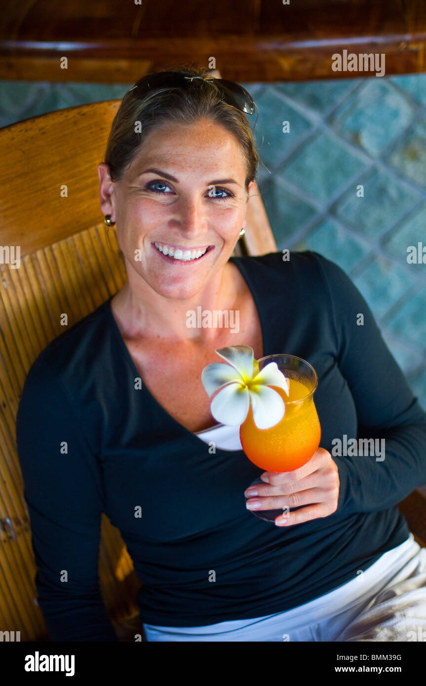Jenny Hannenberg enjoys drinks from Fregate Resort Stock Photo