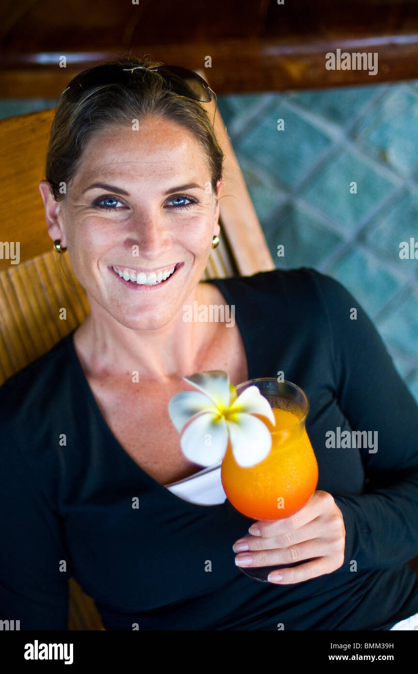 Jenny Hannenberg enjoys drinks from Fregate Resort Stock Photo
