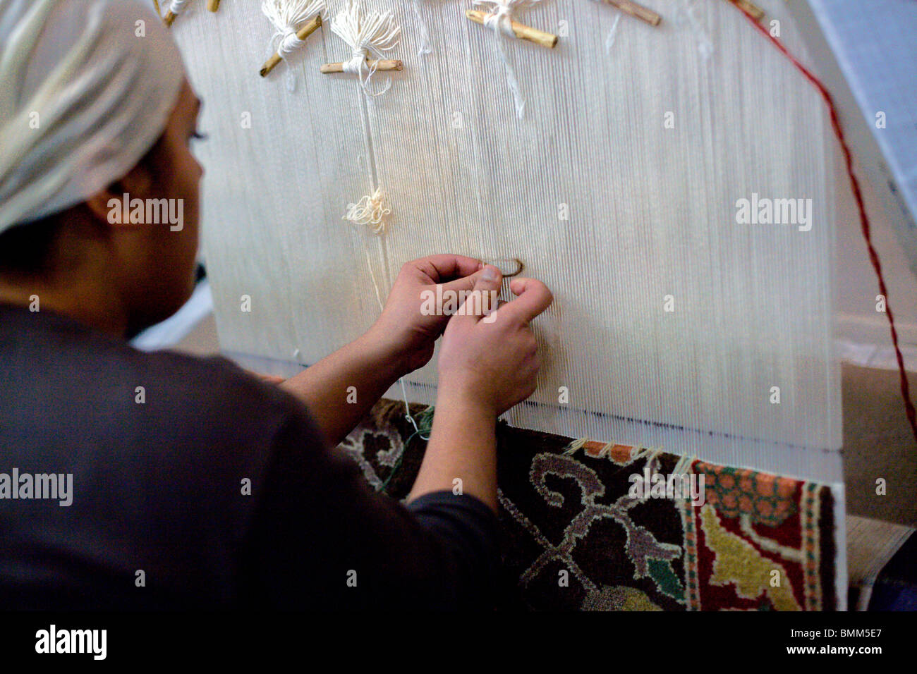 Turkish Woman Making Rug A young woman making a carpet in Turkey Stock Photo - Alamy
