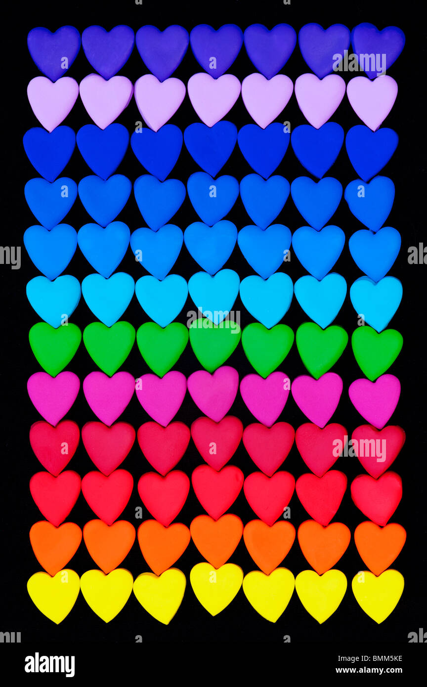 Multicoloured heart shape pattern against black background Stock Photo