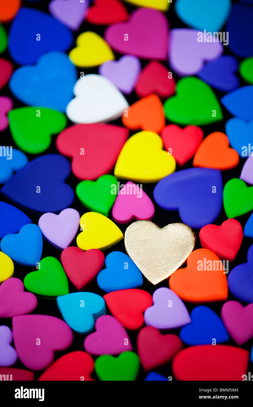 Multicoloured heart shape pattern against black background Stock Photo