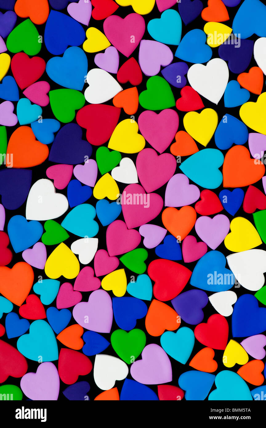 Multicoloured heart shape pattern against black background Stock Photo