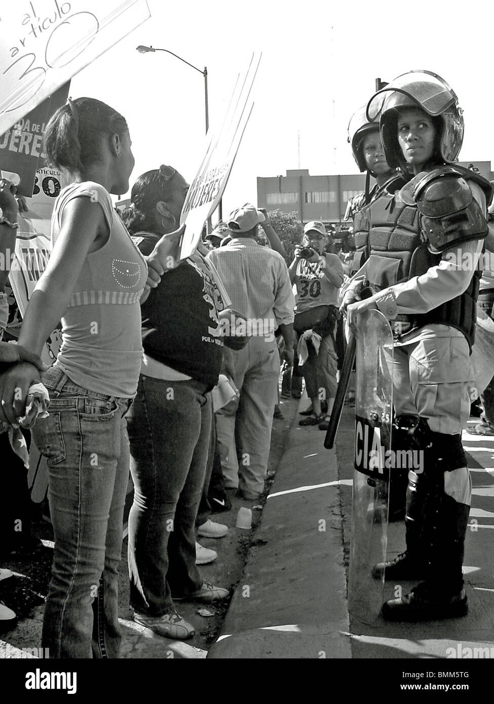 Female riot police at a protest over 'article 30' of the Dominican Republic constitution that has made abortion illegal Stock Photo