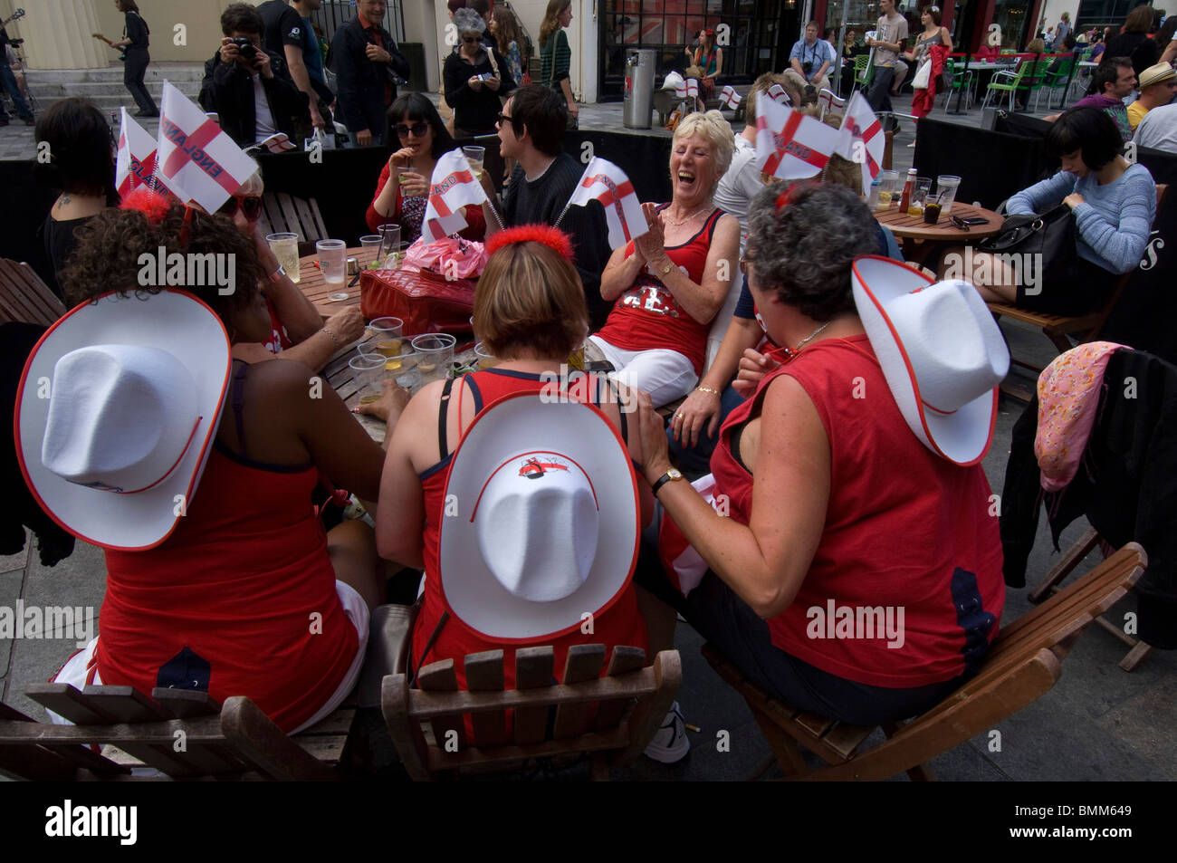A group of middle aged female football fans drinking outside a Brighton pub before the England World Cup opening match 2010. Stock Photo