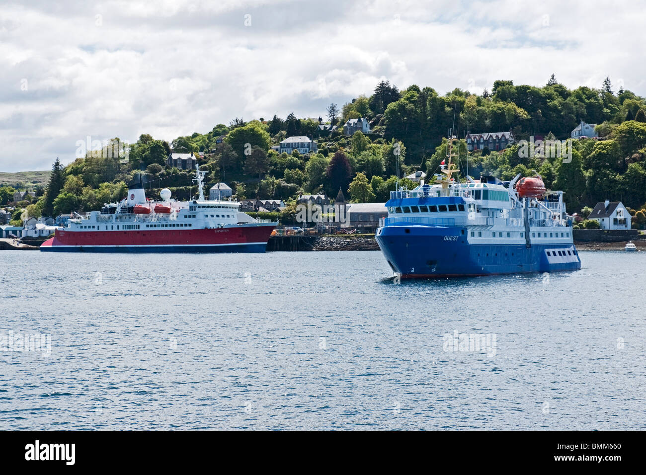 Cruise ships Expedition (left) and Quest (right) lying in Oban harbour Lorn Scotland Stock Photo