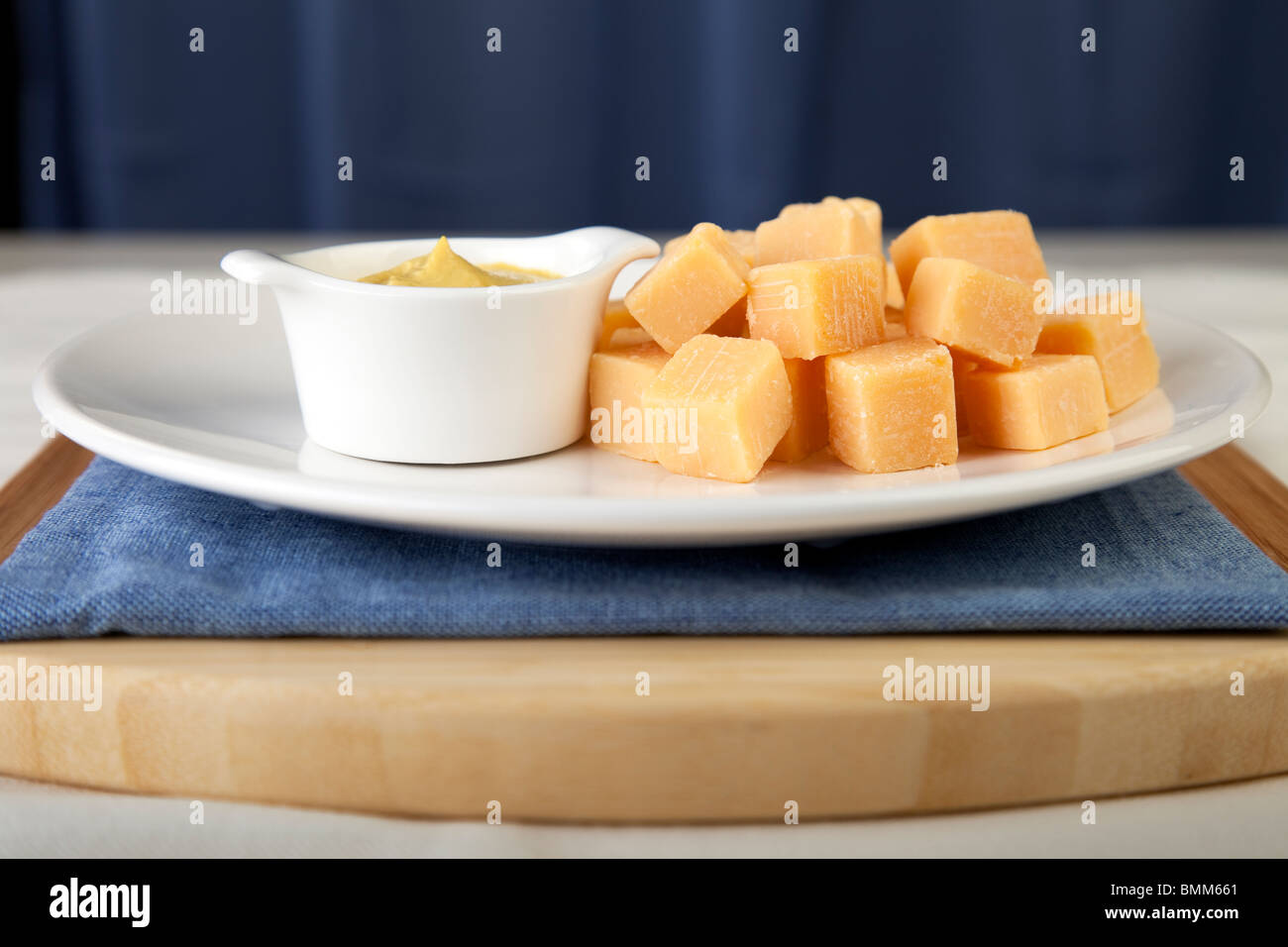 Cheese Cubes with Spicy Mustard Stock Photo Alamy