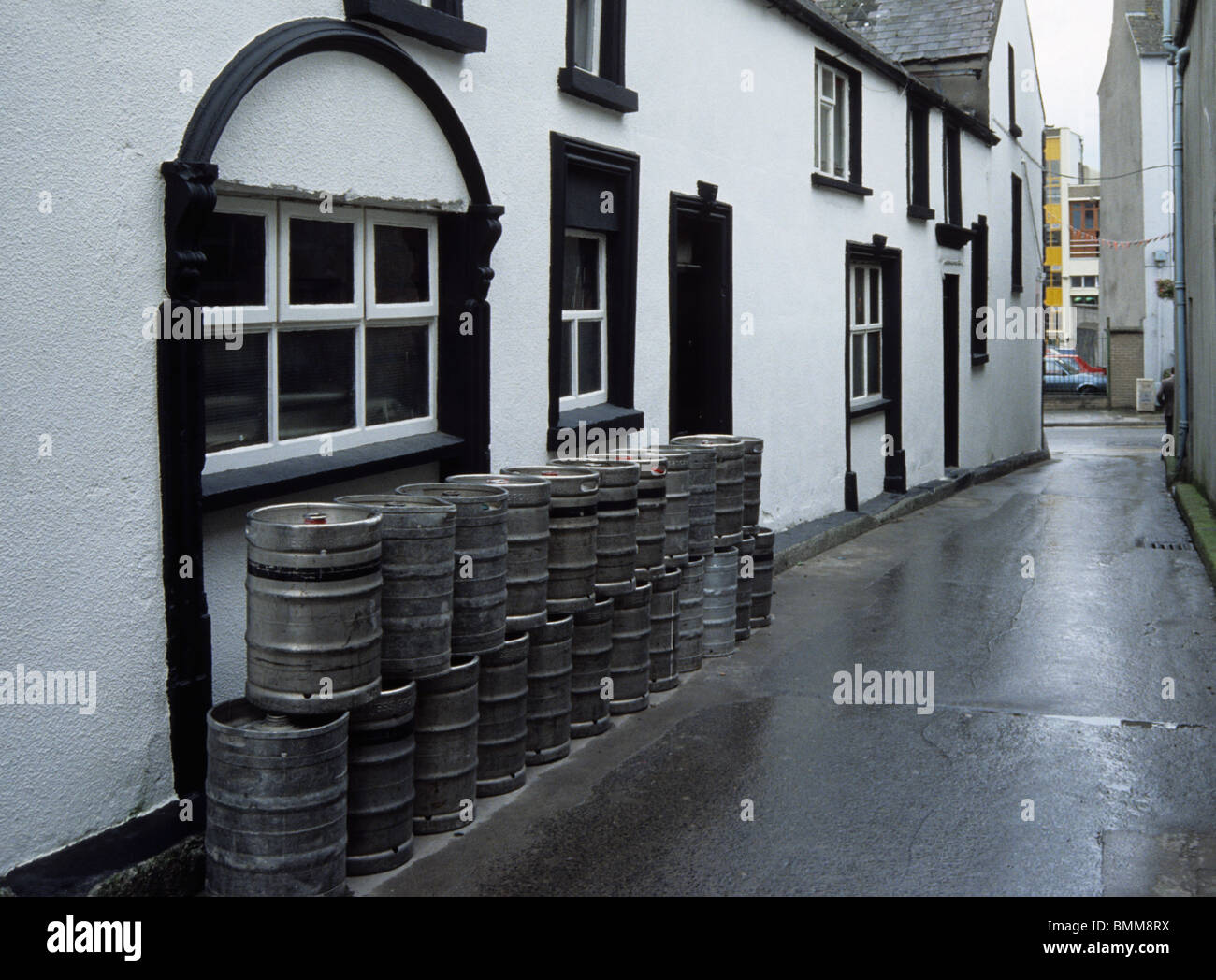 pile of beer barrels outside pub in Wexford town Ireland Stock Photo