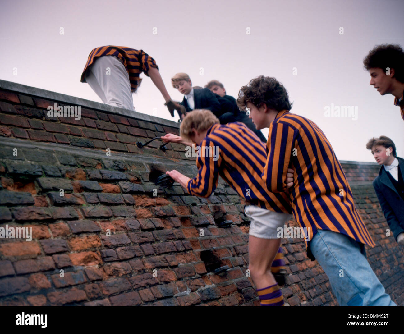 Eton College Wall Game 1980's. Boys of the Oppidan team climb over the ...