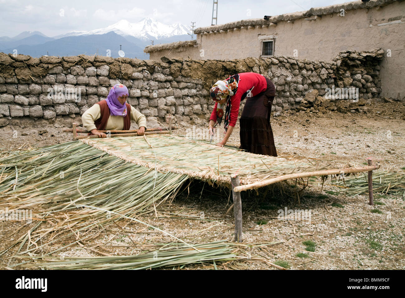 Women weawing reed mattress, Erciyes Turkey Stock Photo - Alamy