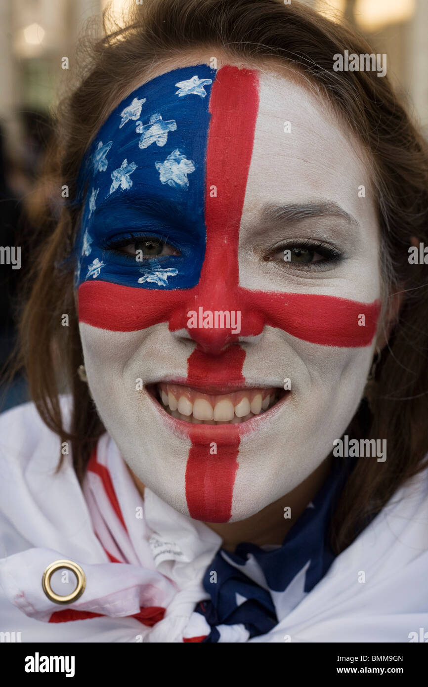 Young woman with painted face of both US and English flags during both countries opening World Cup group match. Stock Photo