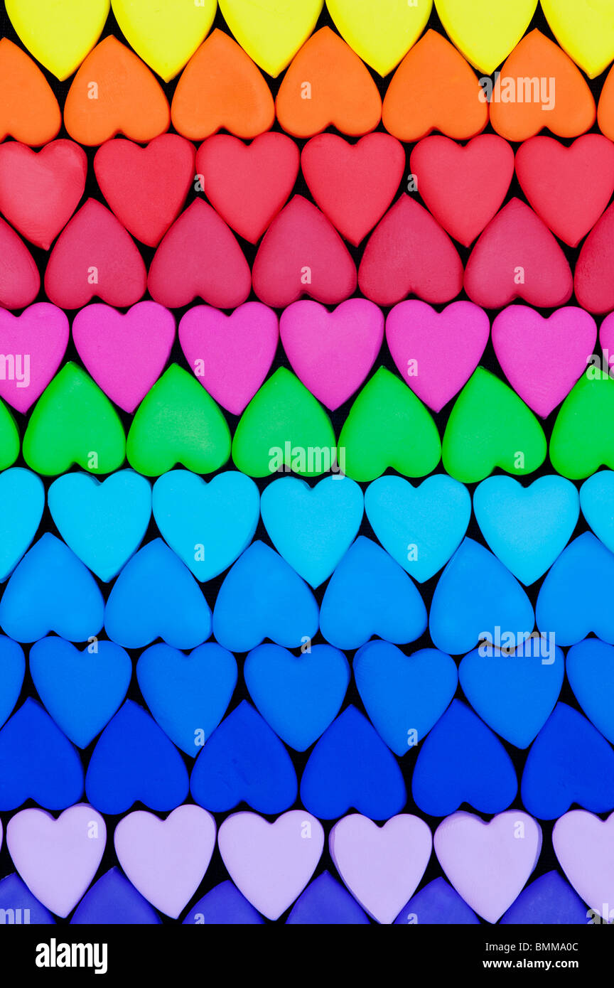 Multicoloured heart shape pattern against black background Stock Photo