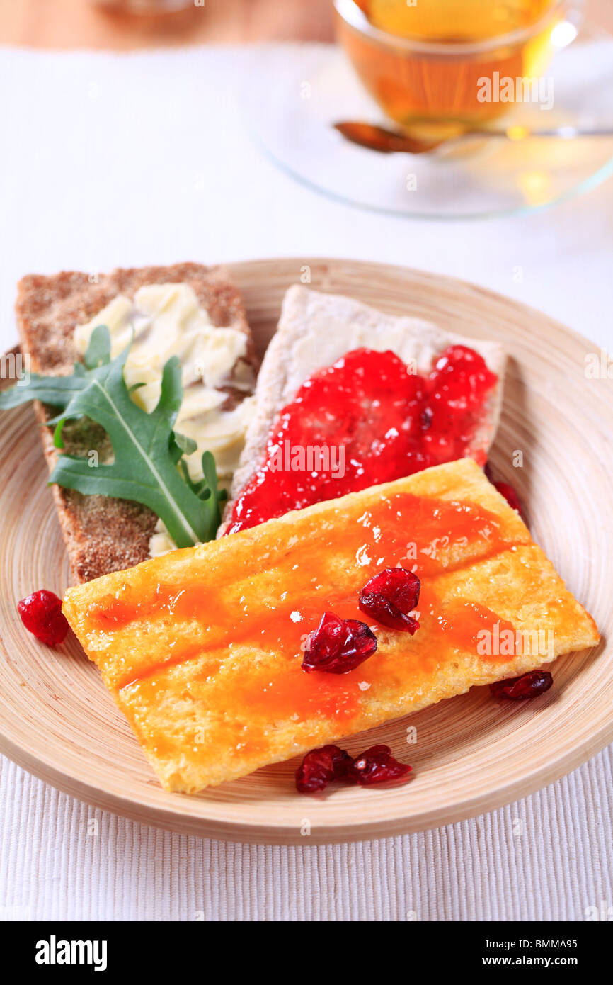 Various types of crisp bread and jam - closeup Stock Photo