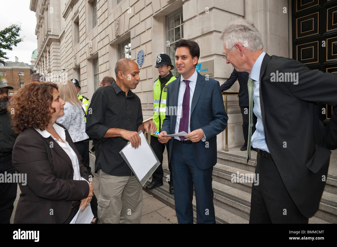 Ed Miliband talks to Climate Chaos Coalition (CCC)  vigil leaders outside DECC in Whitehall Stock Photo