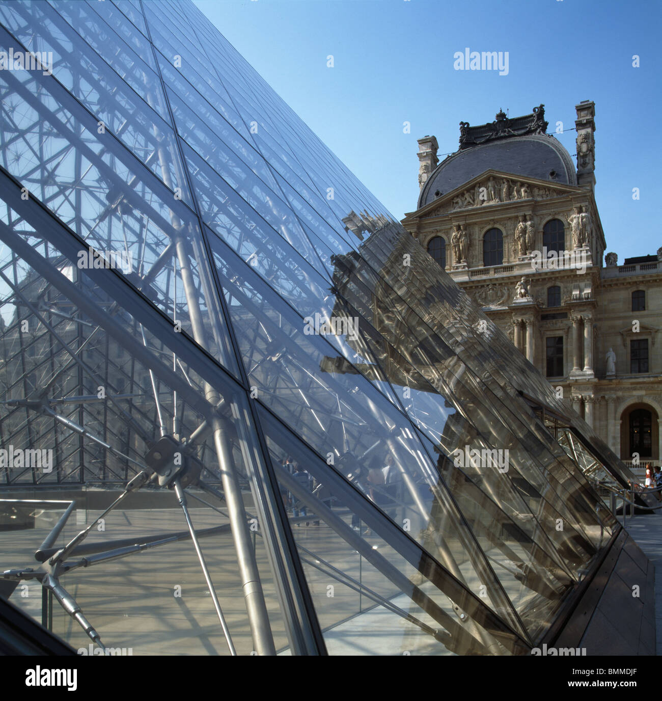 Louvre Museum, Paris. Steel and glass pyramid, by I.M. Pei, 1988  & courtyard with Pavilion Denon behind. Stock Photo