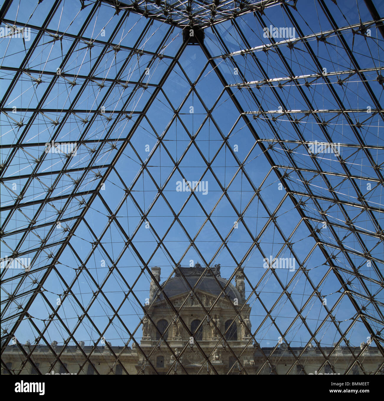 Louvre Museum, Paris. Steel and glass pyramid, by I.M. Pei, 1988 with Pavilion Denon behind. Stock Photo