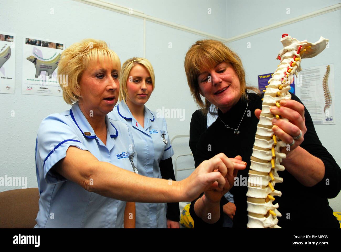 Healthcare workers undergoing training in basic anatomy for lifting duties of frail, disabled and elderly people, Wirral, UK. Stock Photo