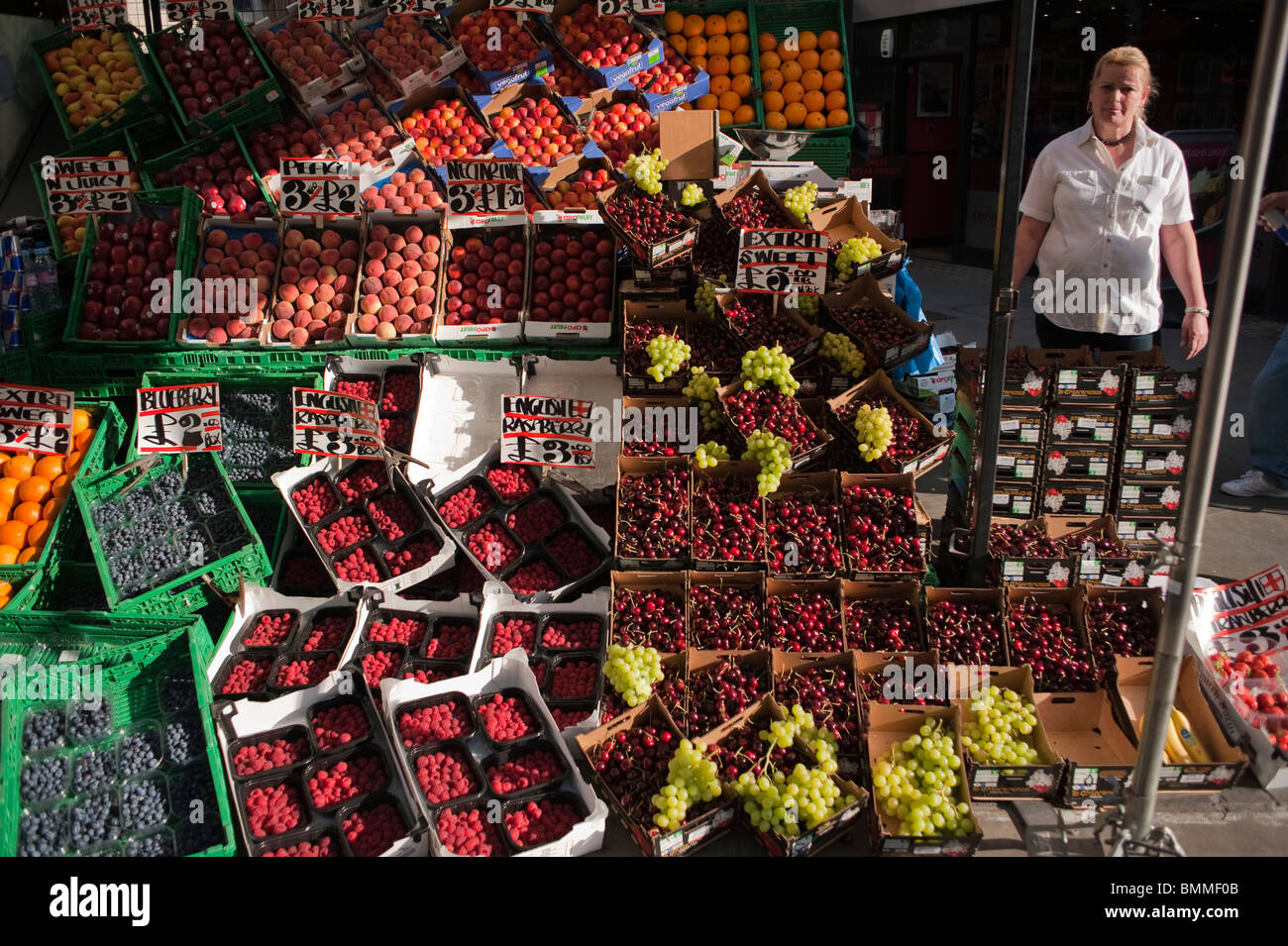 Shopping on Oxford Street, London, UK, Woman Clerk Selling Fresh Fruits