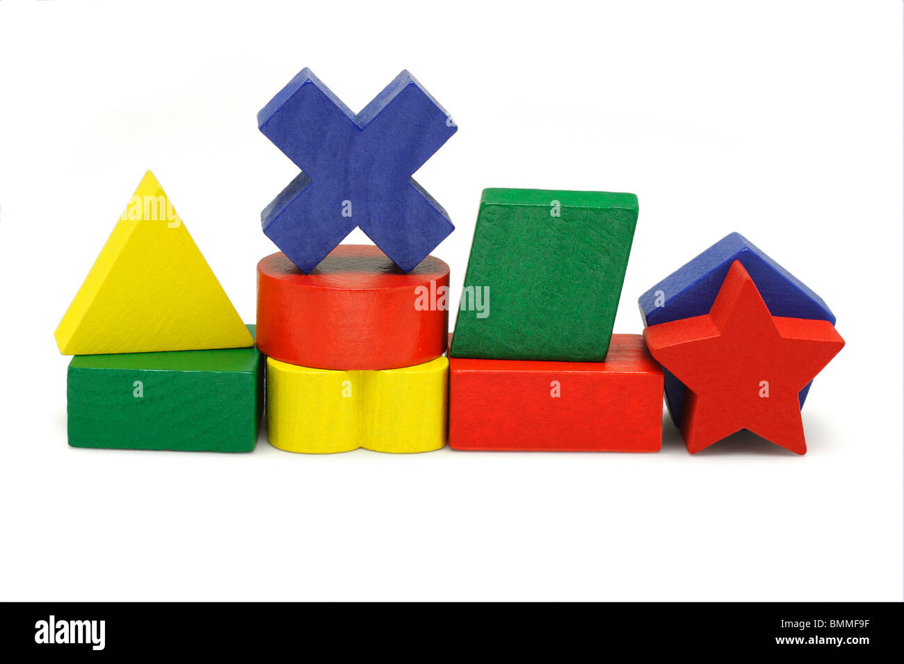Wooden geometric toy blocks on white background Stock Photo