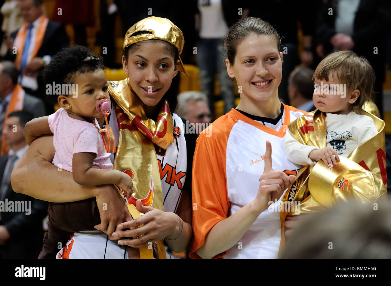 Candace Parker (left) and Olga Arteshina (right) with their children Stock Photo