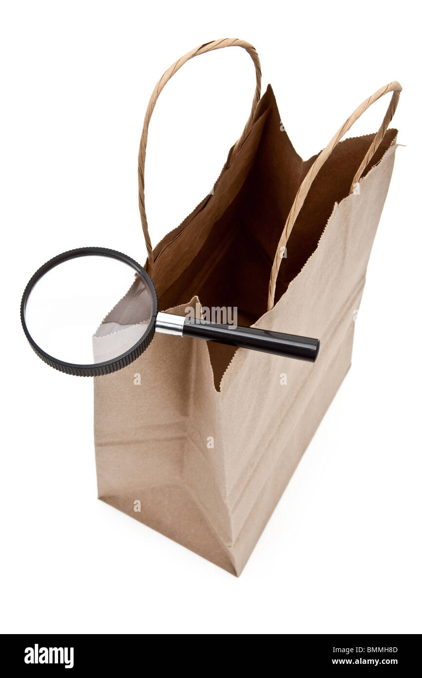 Brown paper shopping bag and Magnifier Stock Photo