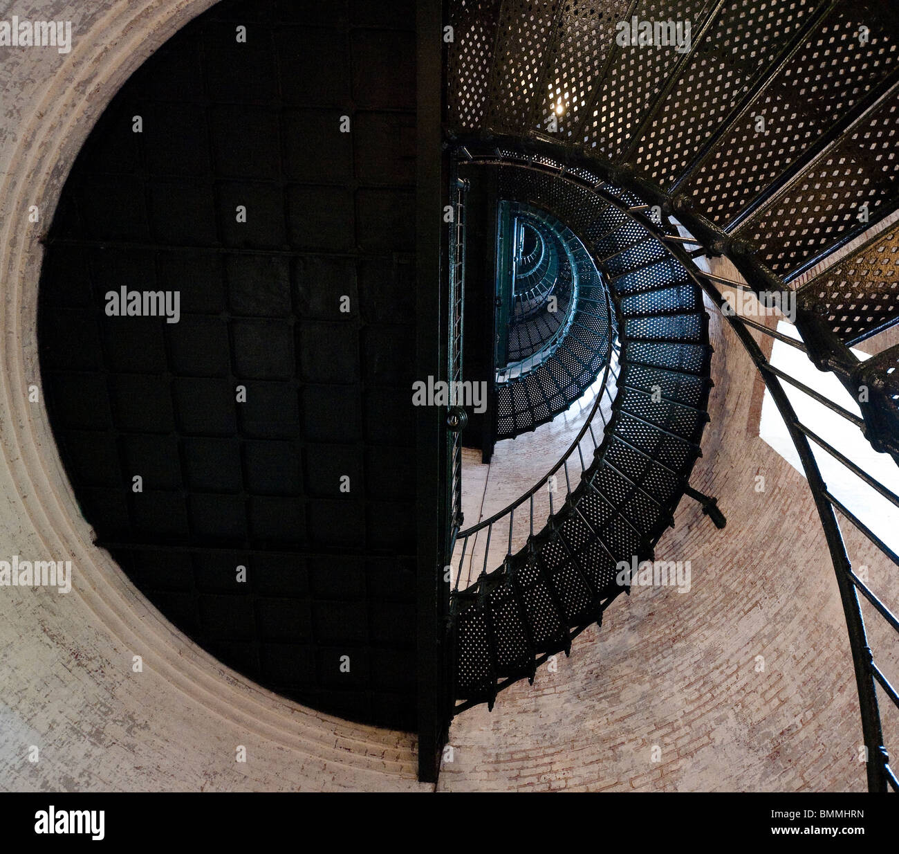 Looking up at a landing on the spiral staircase to the observation deck of the Currituck Beach Light Station in the Outer Banks. Stock Photo