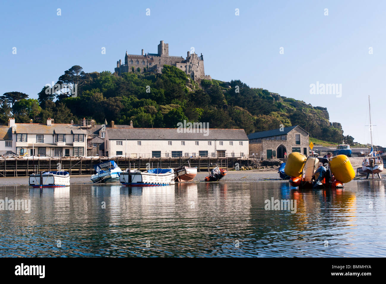 Boats in St Michaels Mount harbour Cornwall photographed from the sea. Stock Photo