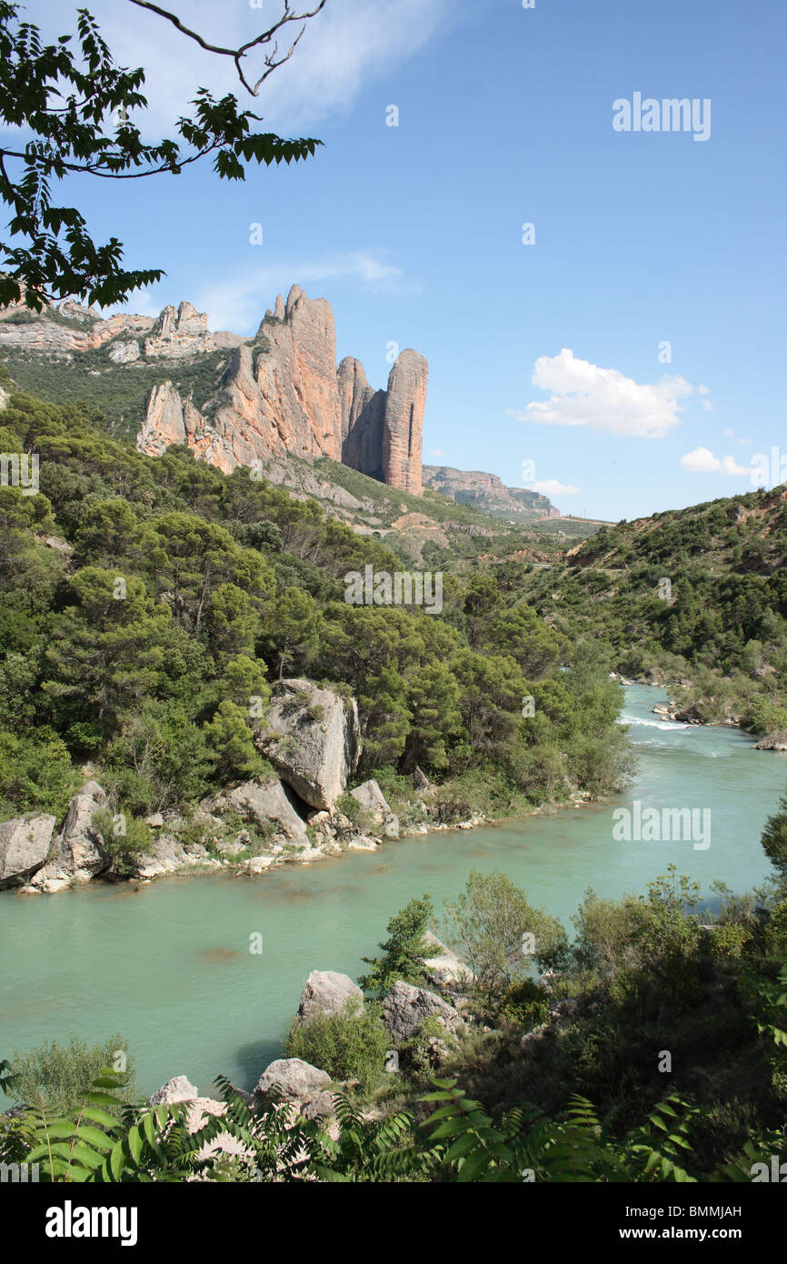 Los Mallos de Riglos rock formations across the Rio Gallego, blue sky, north of Ayerbe, Huesca, Pyrenees Stock Photo