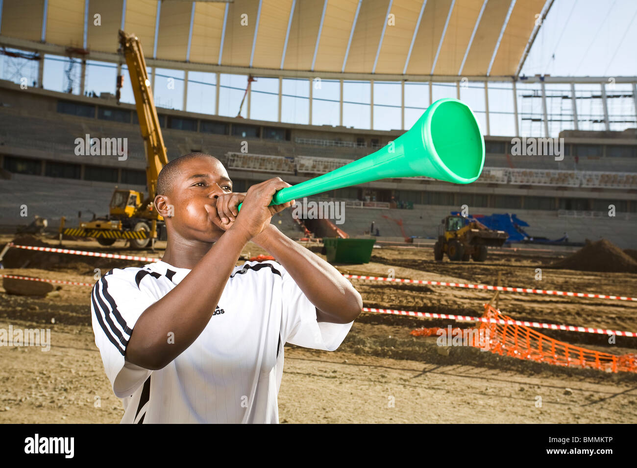 Football player blowing vuvuzela, Moses Mabhida Stadium, Durban, Kwazulu-Natal Province, South Africa Stock Photo