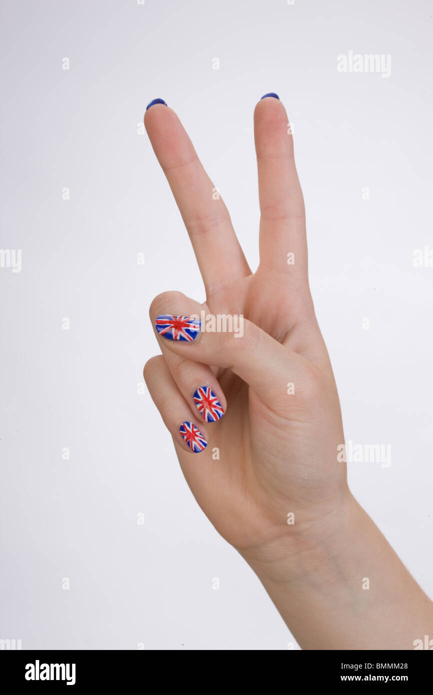 Hand with british flag painted on the fingernails forming a victory sign Stock Photo