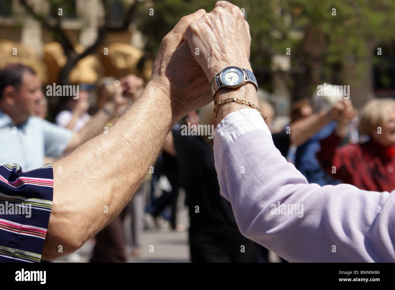 Spanish People dancing their traditional dance the Sardana outside the Cathedral in Barcelona Spain Stock Photo