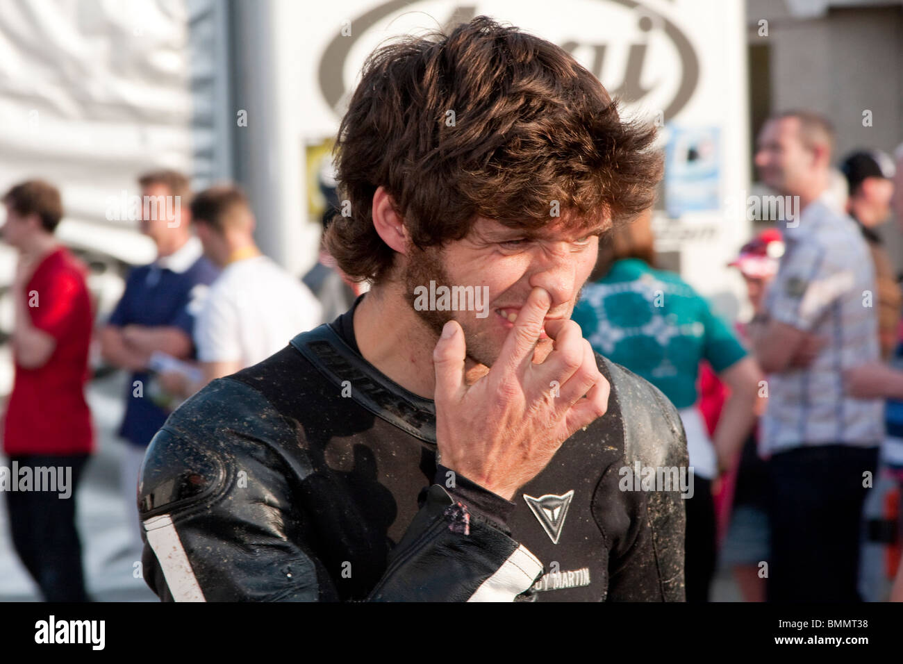 Guy Martin at the 2010 Isle of Man TT picking his nose the week before his explosive accident. Stock Photo
