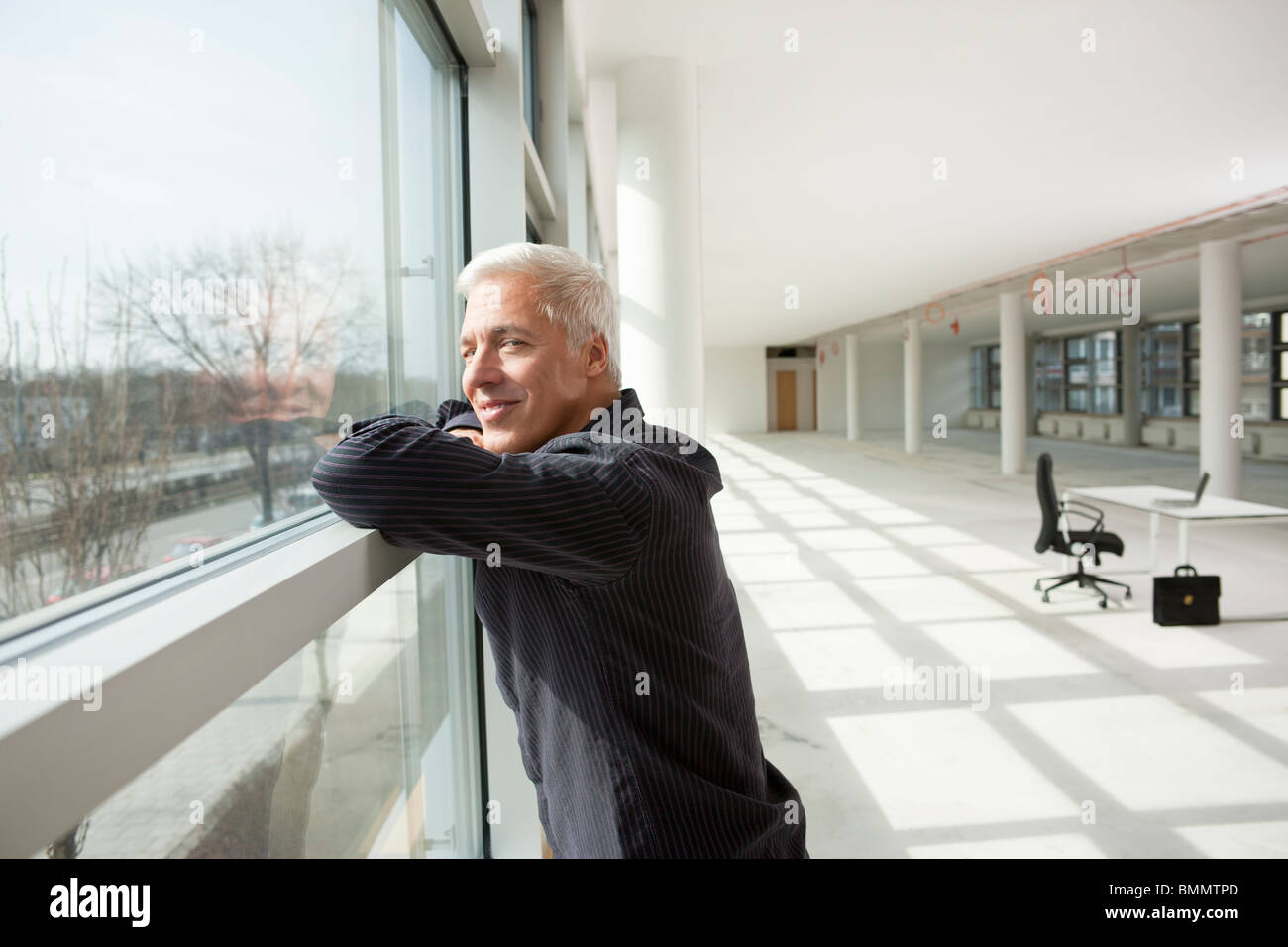 Businessman thinking about future office Stock Photo