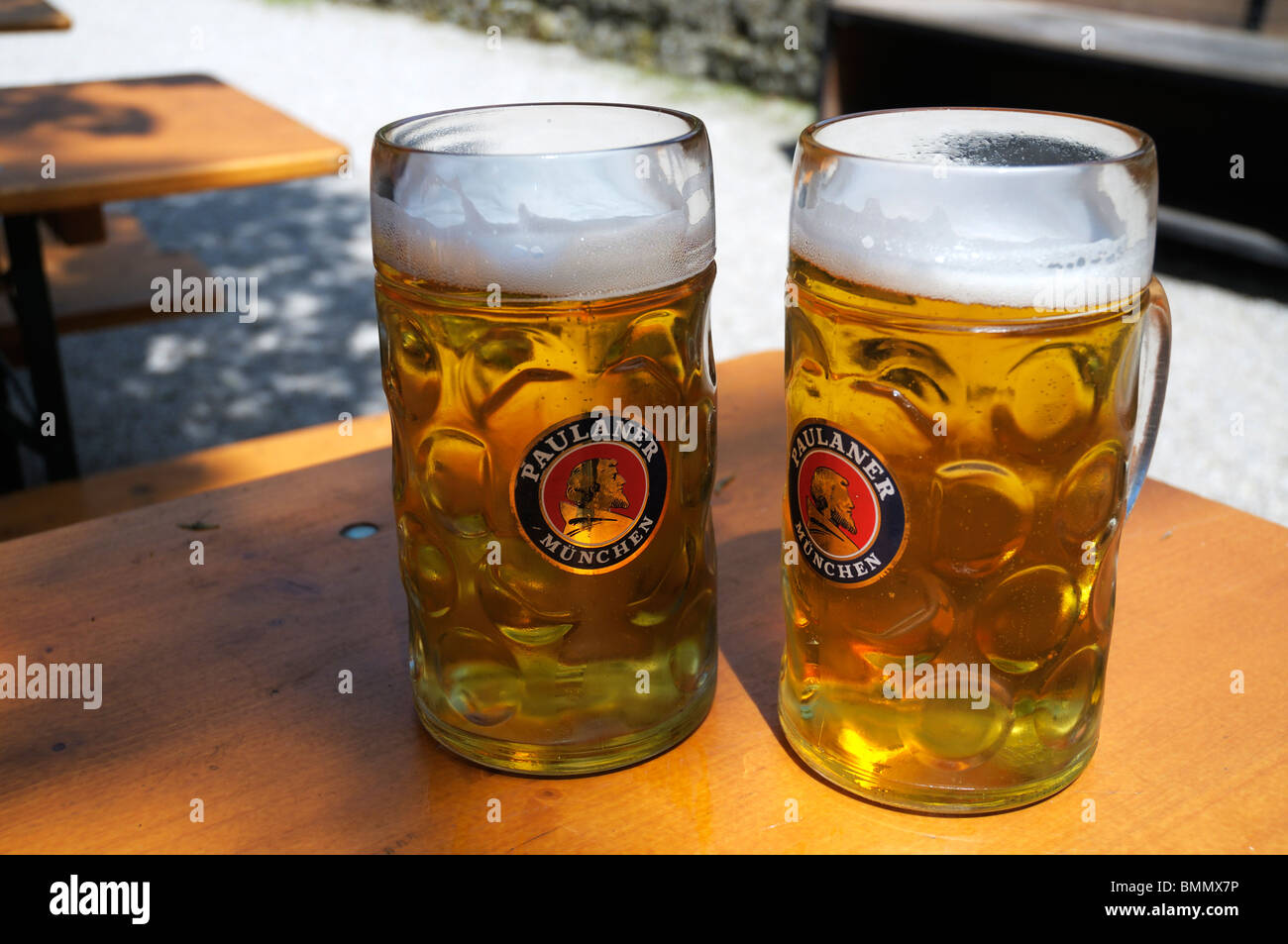two litre masskrugs of Paulaner helles bier, Munich, Germany Stock Photo